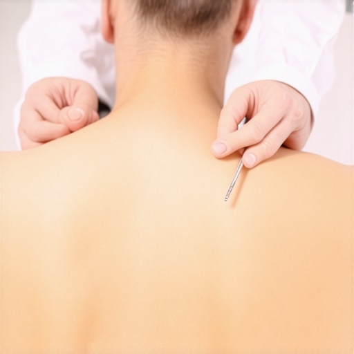 Doctor examining patient's back during a clinical assessment.